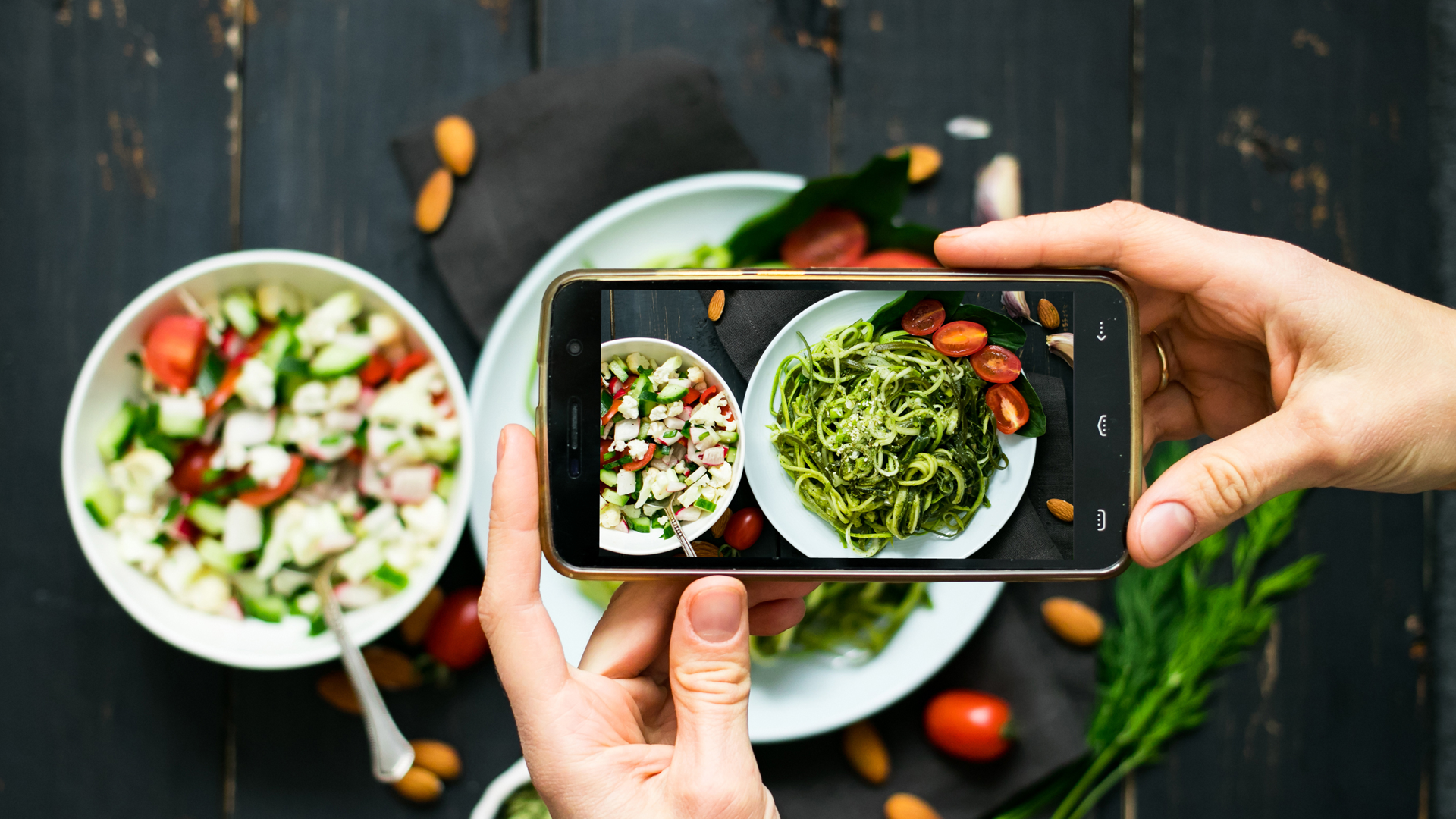 UK influencer taking picture of food with smartphone